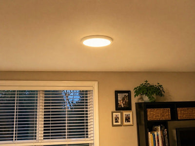 Lumitho round ceiling light casting a warm glow in a room
